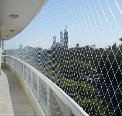 Invisible grill installation on a balcony