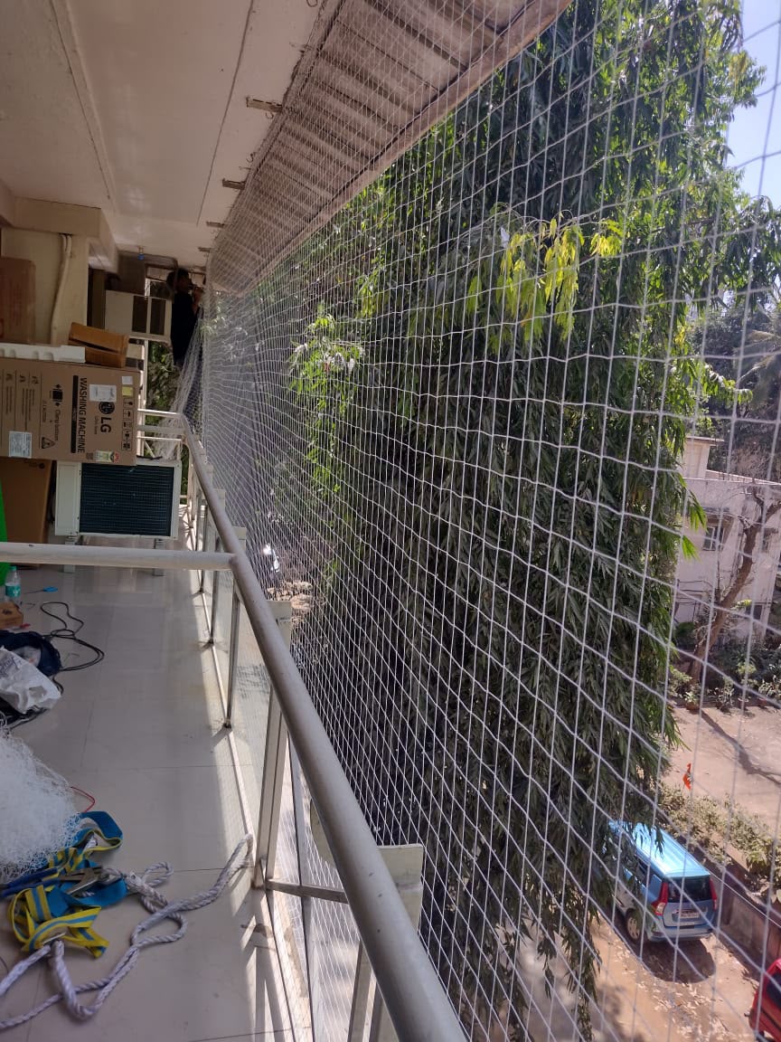 Invisible grill installation on a balcony