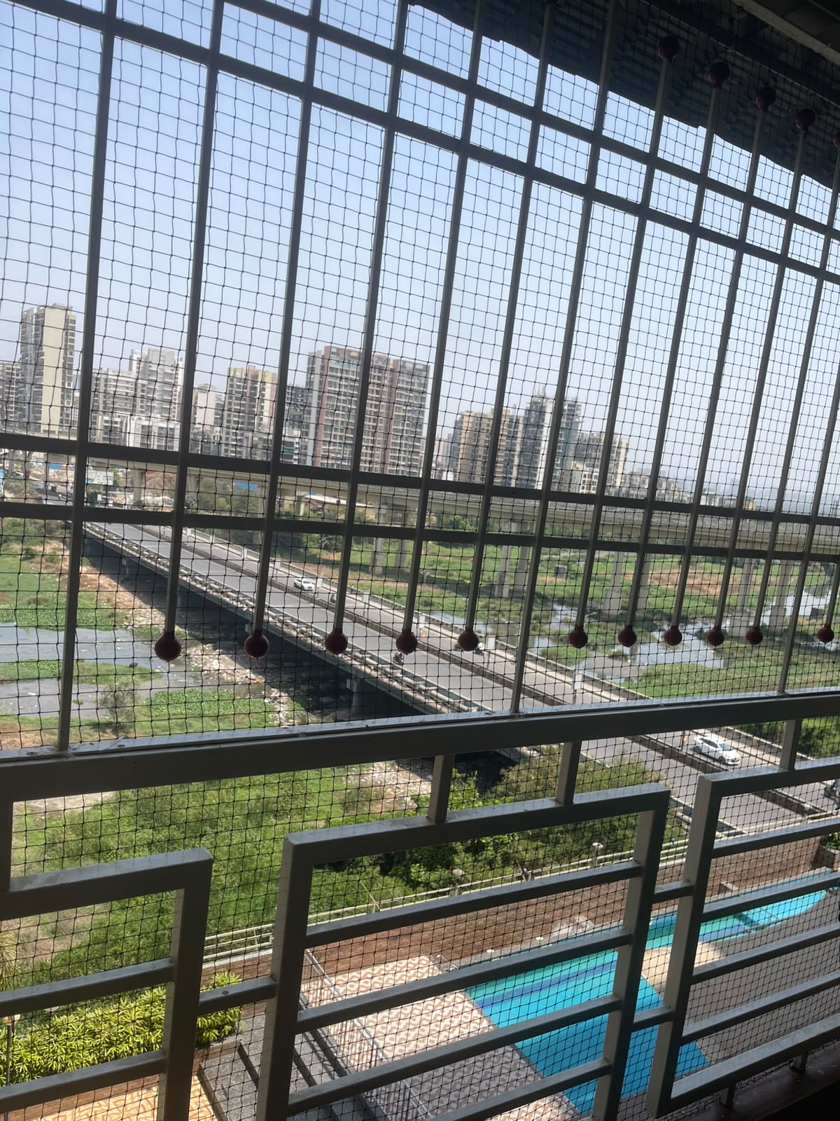 Invisible grill installation on a balcony