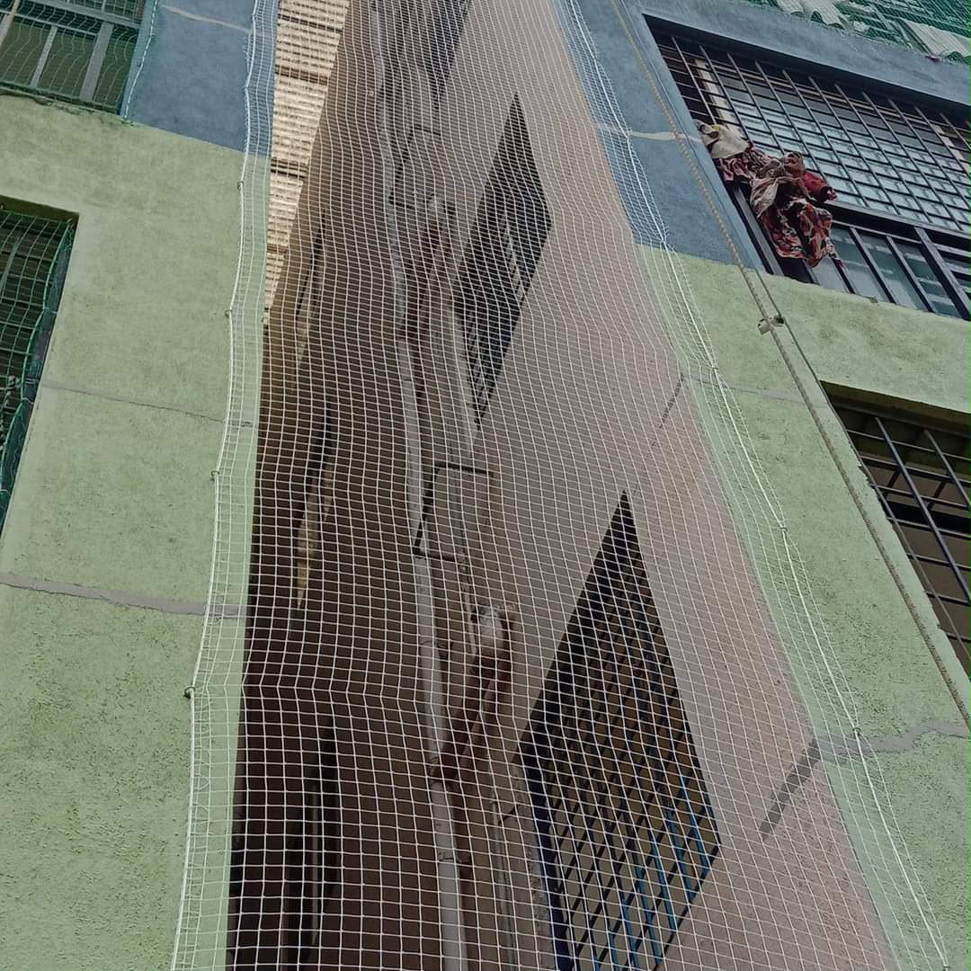 Invisible grill installation on a balcony