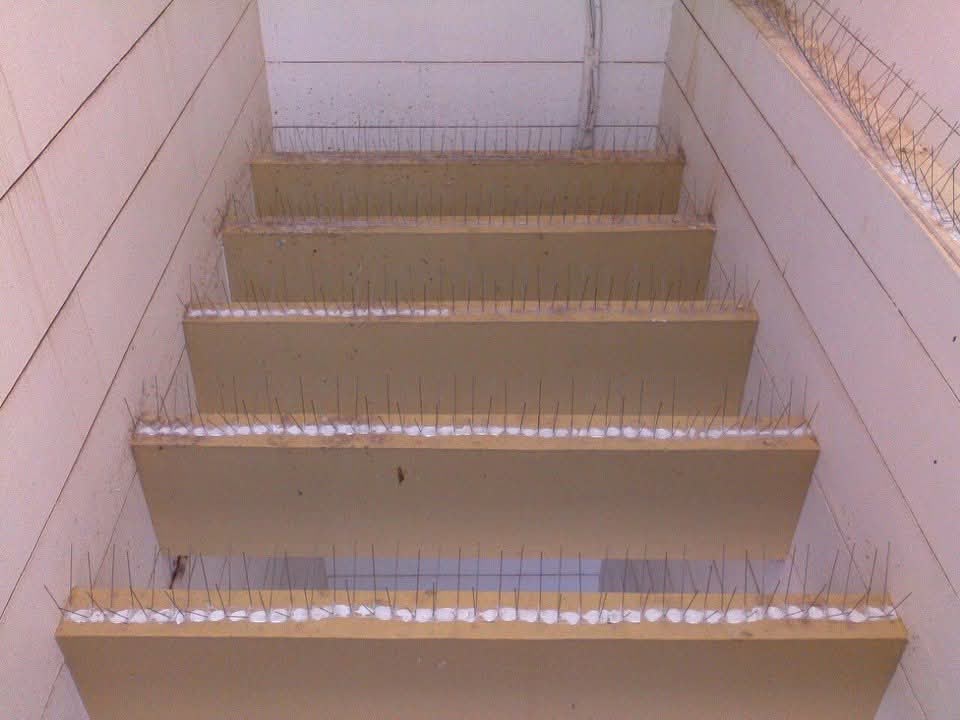 Invisible grill installation on a balcony