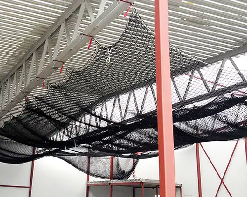 Safety net over a building shaft